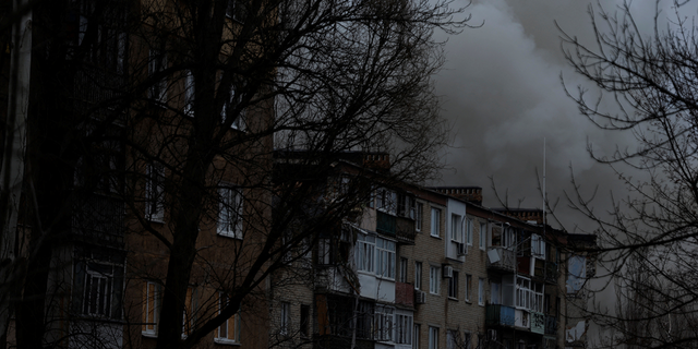 Smoke rises from apartment buildings damaged from missile strikes, as Russia's attack on Ukraine continues, during intense shelling on Christmas Day at the frontline in Bakhmut, Ukraine.