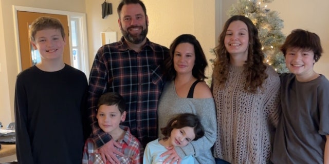 Matthew Spielmann, 37, and Ashley Spielmann, 37, are pictured here with their children. "We know what a good life our dogs have," Ashley Spielmann told SWNS.