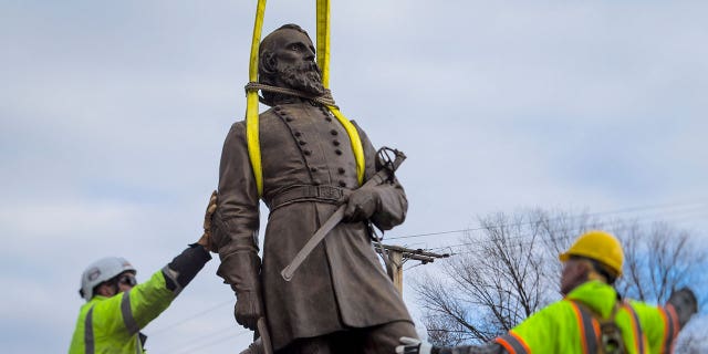 Richmond, Virginia, has removed its last city-owned Confederate monument in an effort to purge itself of racially oppressive symbols. Pictured: Workers begin to lay the monument of Confederate Gen. A.P. Hill on Dec. 12, 2022.