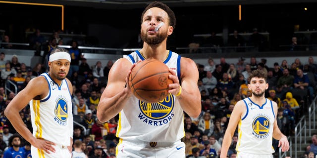 Stephen Curry of the Golden State Warriors prepares to shoot a free throw during a game against the Indiana Pacers Dec. 14, 2022, at Gainbridge Fieldhouse in Indianapolis.