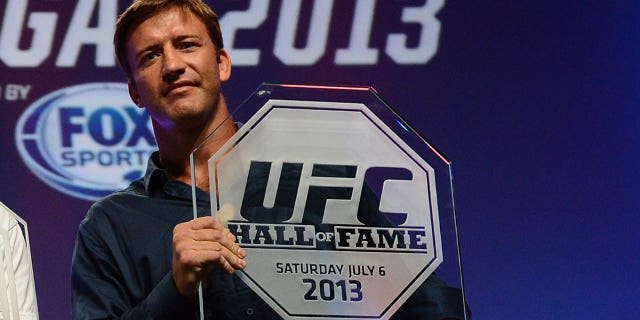 Stephan Bonnar holds his UFC Hall of Fame plaques during the UFC Fan Expo Las Vegas at the Mandalay Bay Convention Center on July 6, 2013.