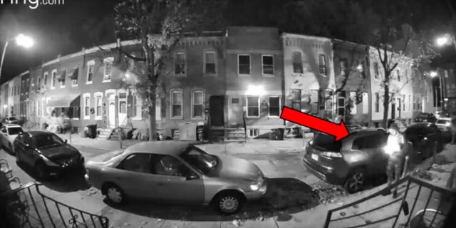Surveillance video allegedly shows the suspect in front of a home he's accused of firebombing.