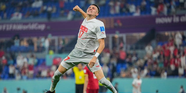 Switzerland's Ruben Vargas celebrates after his teammate Remo Freuler scored his side's third goal during a World Cup Group G soccer match against Serbia at the Stadium 974 in Doha, Qatar, Friday, Dec. 2, 2022. 