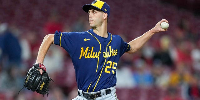 Taylor Rogers, #25 of the Milwaukee Brewers, pitches in the eighth inning against the Cincinnati Reds at Great American Ball Park on September 24, 2022 in Cincinnati, Ohio.