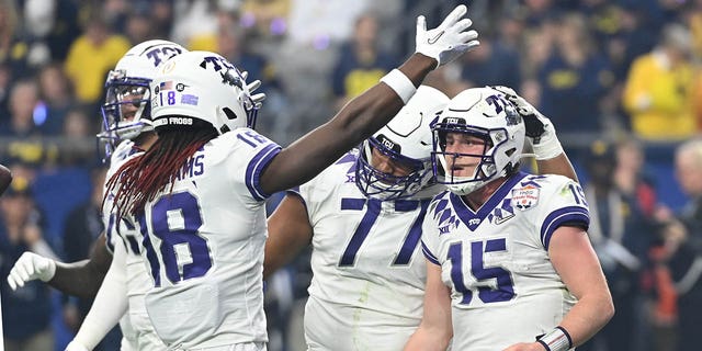 Max Duggan #15 of the TCU Horned Frogs reacts after rushing for a touchdown during the first quarter against the Michigan Wolverines in the Vrbo Fiesta Bowl at State Farm Stadium on December 31, 2022 in Glendale, Arizona. 