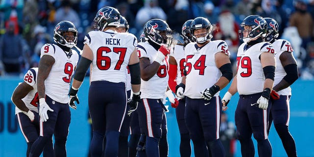 The Houston Texans huddle up on the field during the first half in the game against the Tennessee Titans at Nissan Stadium on December 24, 2022 in Nashville, Tennessee.