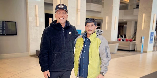 Maj. Thomas Schueman poses for a photo with his former interpreter Zainullah Zaki.