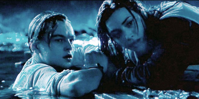 The movie "Titanic", written and directed by James Cameron. Seen here from left, Leonardo DiCaprio as Jack and Kate Winslet as Rose after the Titanic has sunk. Initial USA theatrical wide release December 19, 1997. Screen capture. Paramount Pictures. 