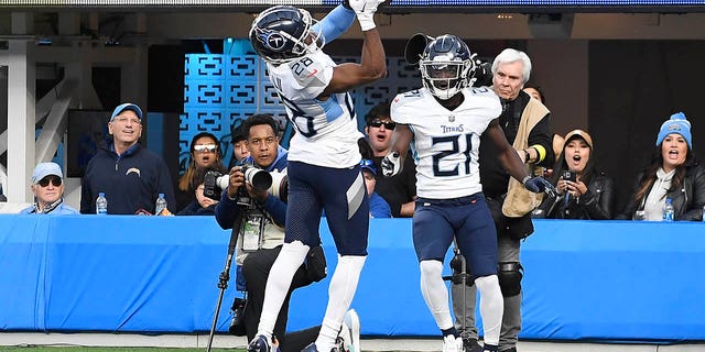 Roger McCreary #21 of the Tennessee Titans tips a pass intended for Mike Williams #81 of the Los Angeles Chargers (not pictured) to Joshua Kalu #28 of the Tennessee Titans for an interception during the second quarter at SoFi Stadium on December 18, 2022 in Inglewood, California.