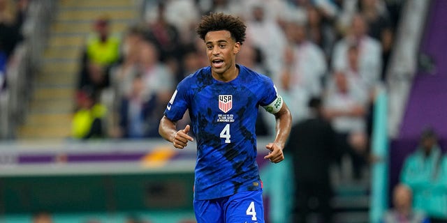 Tyler Adams of the United States runs on the pitch during the World Cup Group B soccer match between England and the United States at Al Bayt Stadium in Al Khor, Qatar, Nov. 25, 2022.