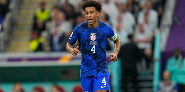 Tyler Adams of the United States runs on the pitch during the World Cup Group B soccer match between England and the United States at Al Bayt Stadium in Al Khor, Qatar, Nov. 25, 2022.