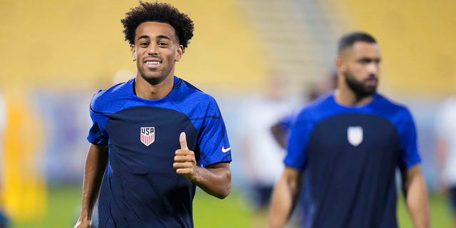 Tyler Adams, left, and Cameron Carter-Vickers, both of the United States, participate in an official training session on the eve of the Group B World Cup match between England and the United States at Al-Gharafa SC Stadium, in Doha, Nov. 24, 2022.