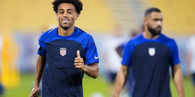 Tyler Adams, left, and Cameron Carter-Vickers, both of the United States, participate in an official training session on the eve of the Group B World Cup match between England and the United States at Al-Gharafa SC Stadium, in Doha, Nov. 24, 2022.