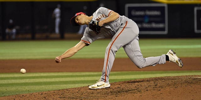 Tyler Rogers #71 of the San Francisco Giants delivers a pitch against the Arizona Diamondbacks at Chase Field on July 4, 2022, in Phoenix, Arizona. 