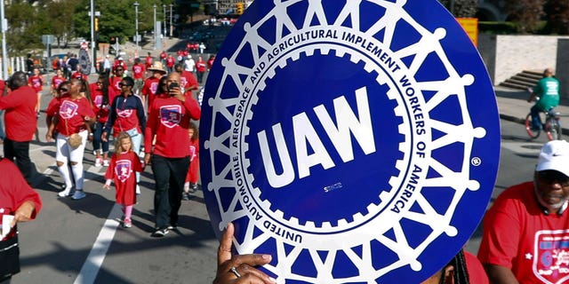 UAW representatives march in Detroit's 2019 Labor Day parade.