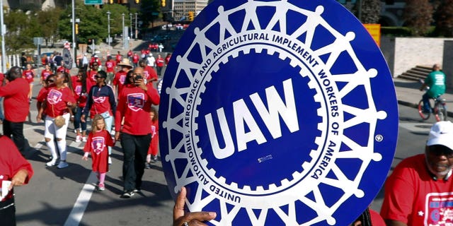 UAW representatives march at the 2019 Labor Day Parade in Detroit.