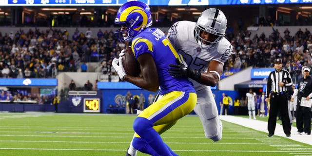 Van Jefferson #12 of the Los Angeles Rams catches the game winning touchdown against Sam Webb #27 of the Las Vegas Raiders during the fourth quarter at SoFi Stadium on December 08, 2022 in Inglewood, California.