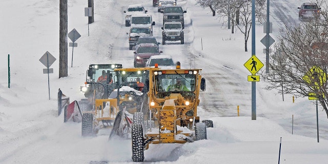 As parts of North Dakota saw snow on Friday, a trio of plows cleared Century Avenue near Jaycee Park in Bismarck.