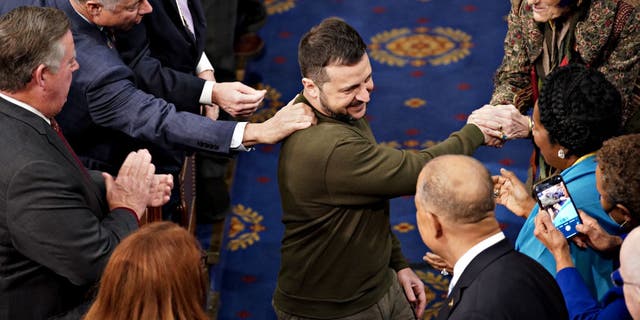 Volodymyr Zelenskyy, Ukraine's president, center, arrives to speak during a joint meeting of Congress at the US Capitol in Washington, DC, US, on Wednesday, Dec. 21, 2022. (Nathan Howard/Bloomberg via Getty Images)