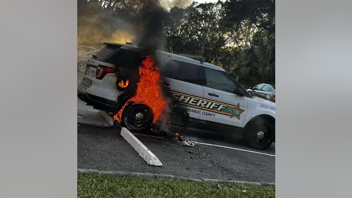 A police vehicle on fire