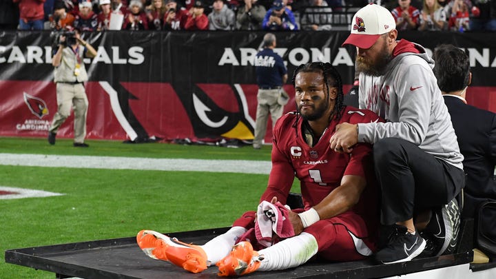 Kyler Murray #1 of the Arizona Cardinals is carted off the field after being injured Norm