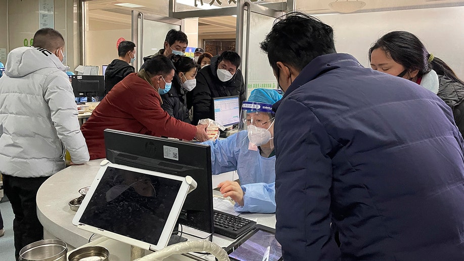 Hospital workers in a crowded room