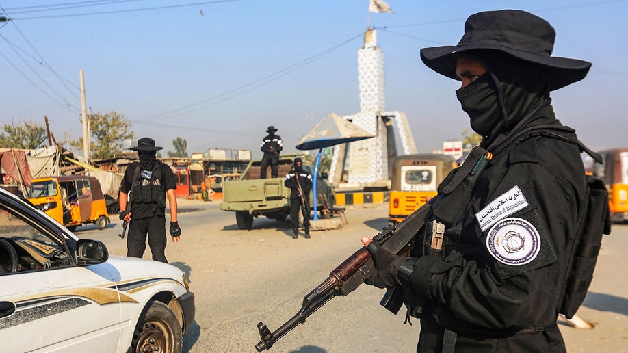 A member of the Taliban holding a rifle