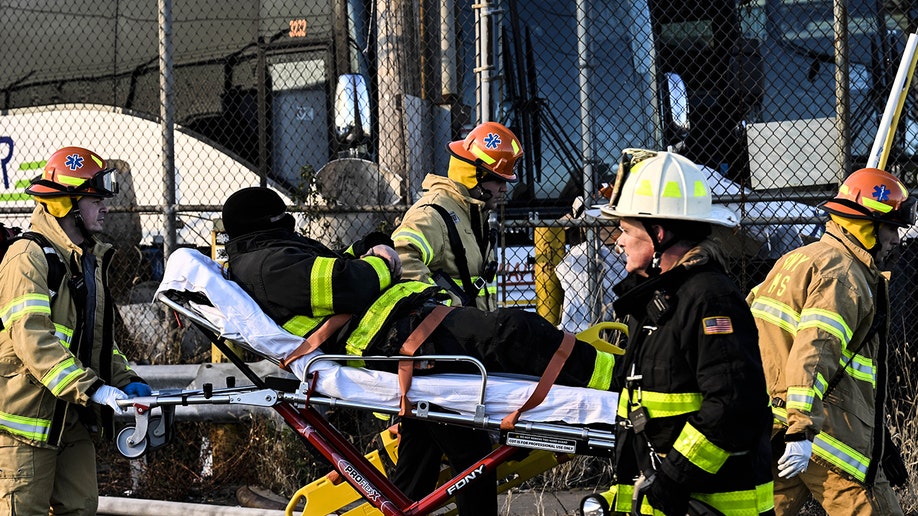 Firefighters assisting a personnel who was injured