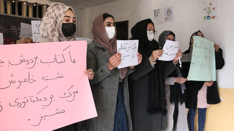 Women holding signs in protest