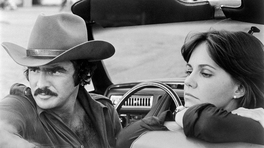 A black-and-white photo of Burt Reynolds and Sally Field