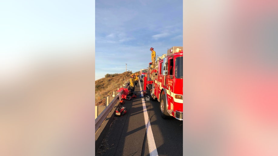 San Bernardino County District firefighters and trucks