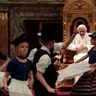 Children in traditional Bavarian folk dresses dancing for Pope Benedict