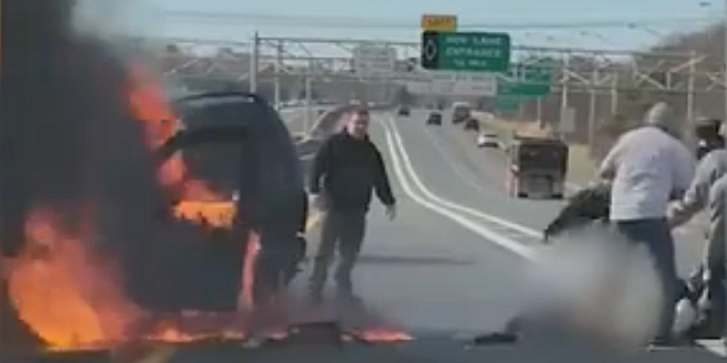 Video shows Good Samaritans rescuing woman from burning car on New York highway