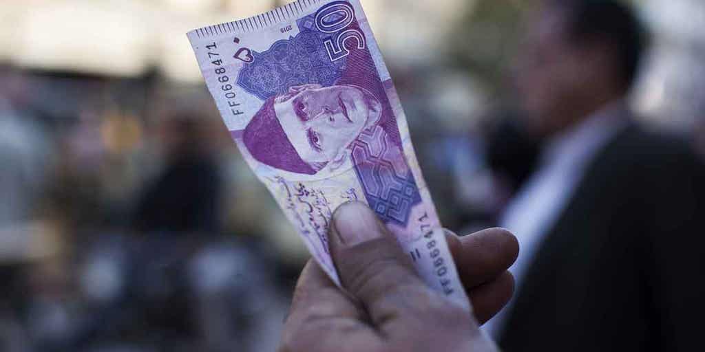 Pakistan's rupee plummets against the dollar as country's government agrees to comply with IMF