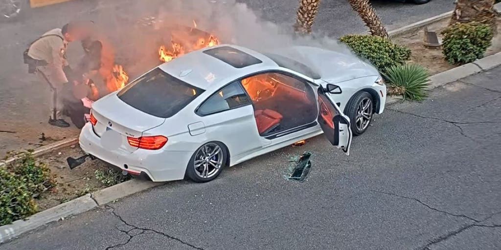 Las Vegas police officer, good Samaritan pull crashed motorist to safety moments before car bursts into flames