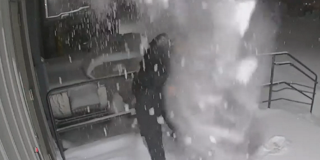 Video shows Wisconsin police officer getting snow dumped on him after closing door