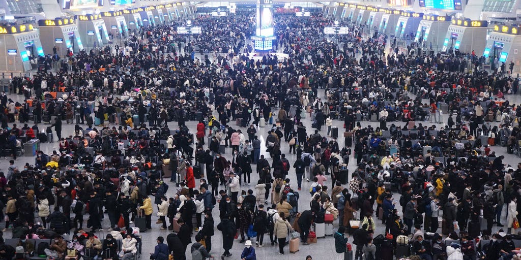 China downplays COVID risks with Lunar New Year travel in full swing