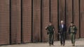 President Joe Biden walks with U.S. Border Patrol agents along a stretch of the U.S.-Mexico border in El Paso Texas, Sunday, Jan. 8, 2023.