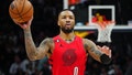 Jan 17, 2023; Denver, Colorado, USA; Portland Trail Blazers guard Damian Lillard (0) prepares to pass the ball in the second half against the Denver Nuggets at Ball Arena.