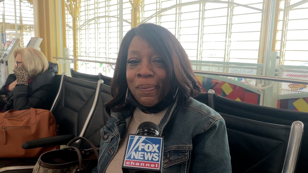 Sharon sitting the airport