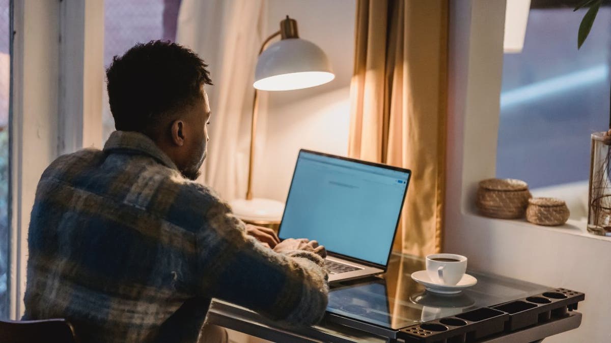 Man typing on MacBook