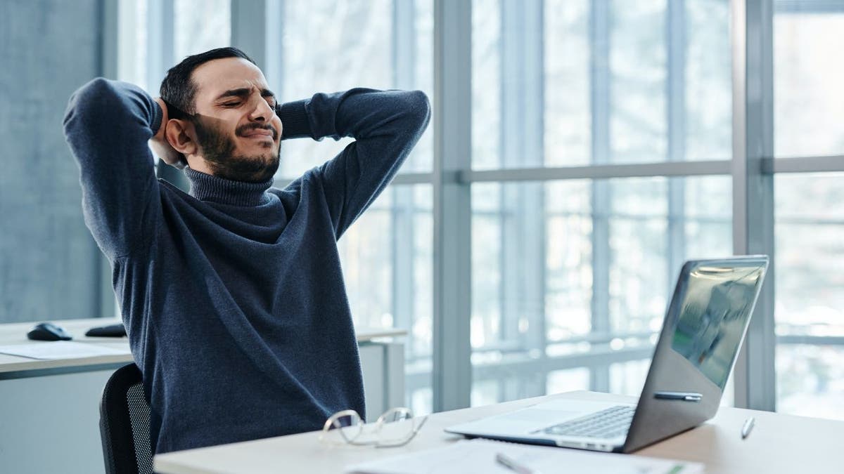 Man looks distressed while at his computer