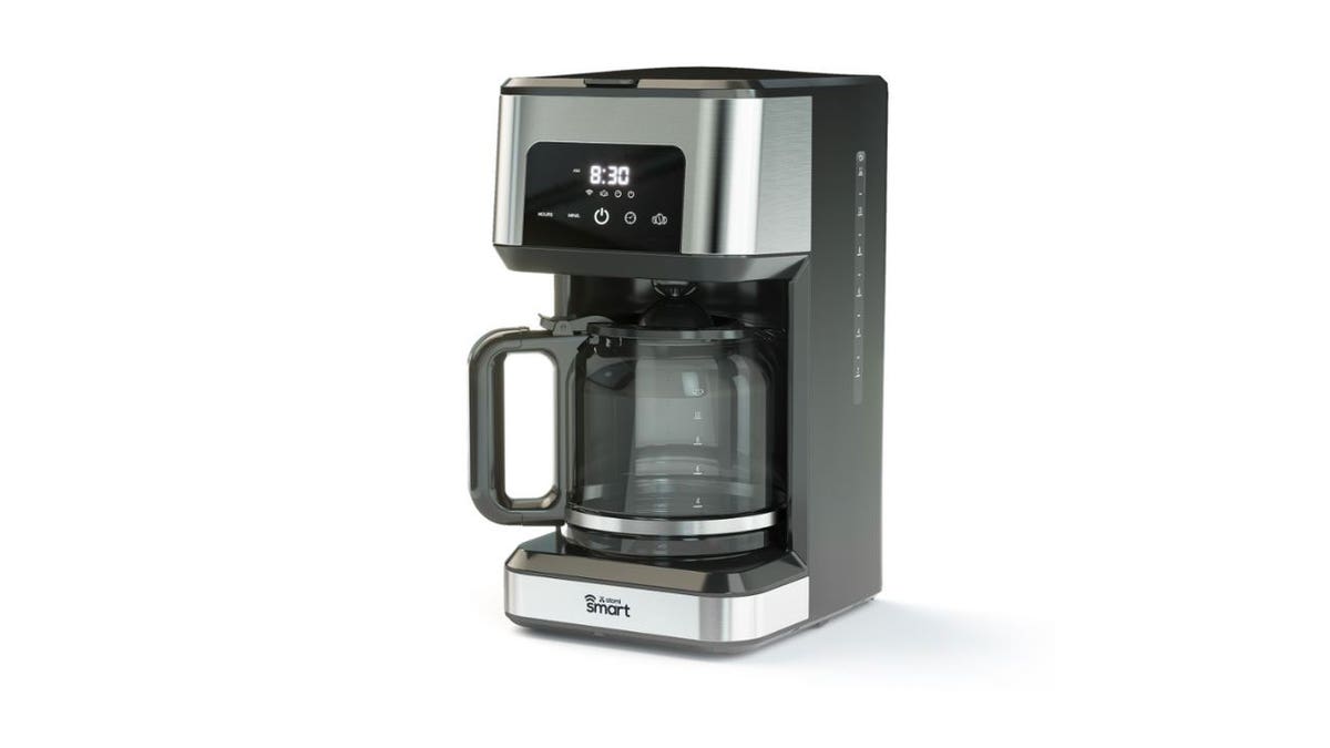 Photo of a silver and black coffee machine.