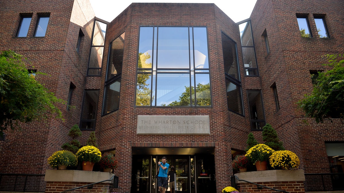 A student leaves the Wharton School of Business on the campus of the University of Pennsylvania in Philadelphia, Pennsylvania, U.S., September 25, 2017. 