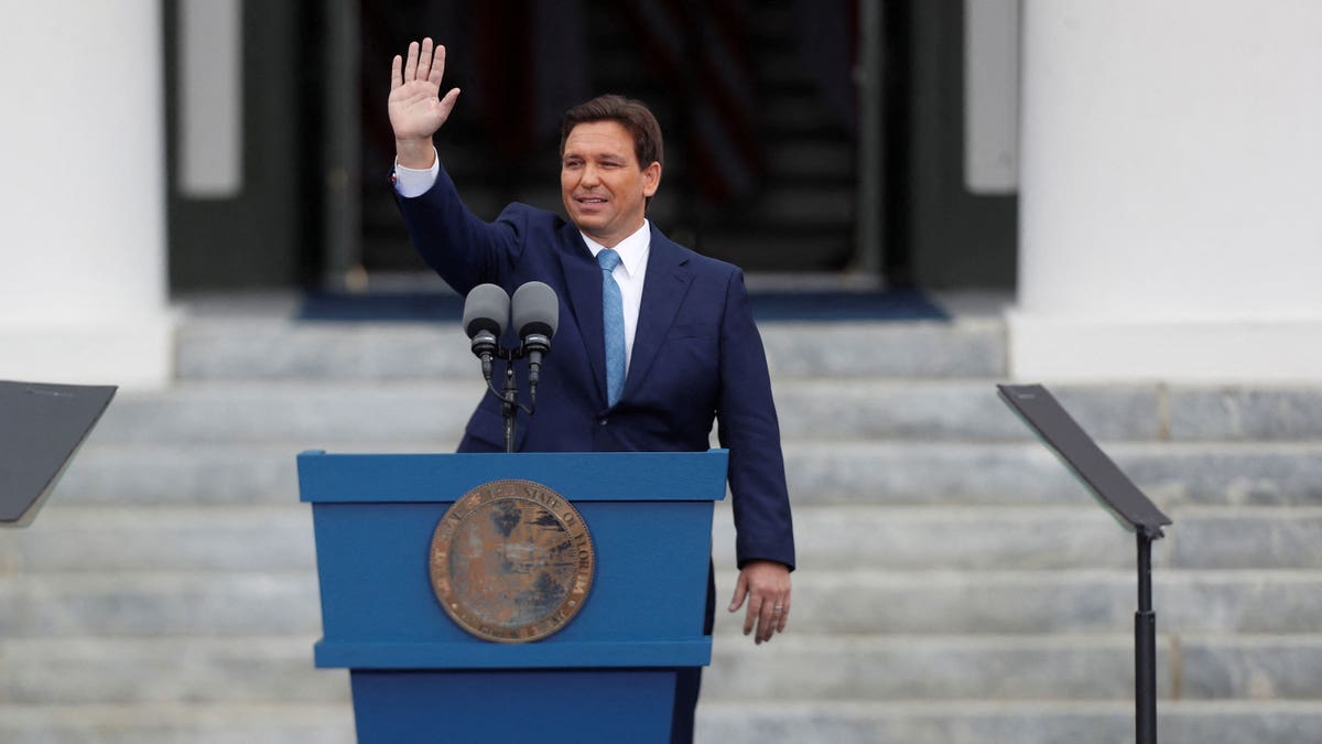 Republican Florida Gov. Ron DeSantis waving