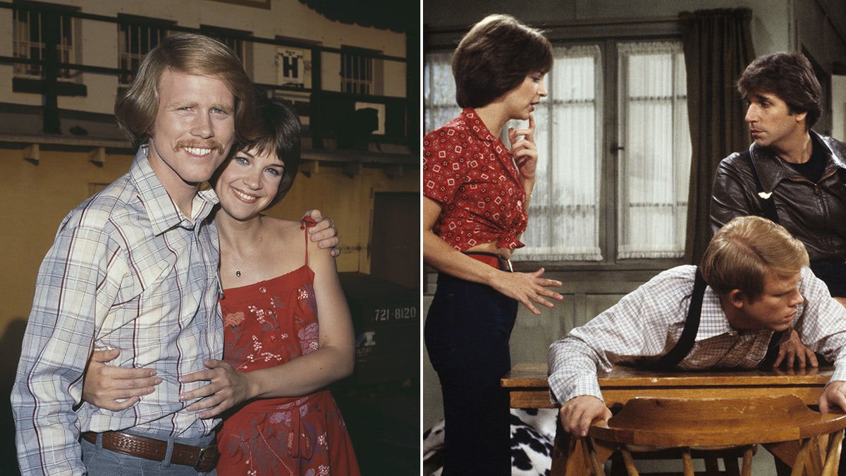 Ron Howard in a light blue plaid shirt and jeans is hugged by Cindy Williams in a red dress split Cindy Williams in a red shirt looking at Ron Howard lying down on a table while Henry Winkler wears a leather jacket as Fonzie during an episode of "Happy Days"