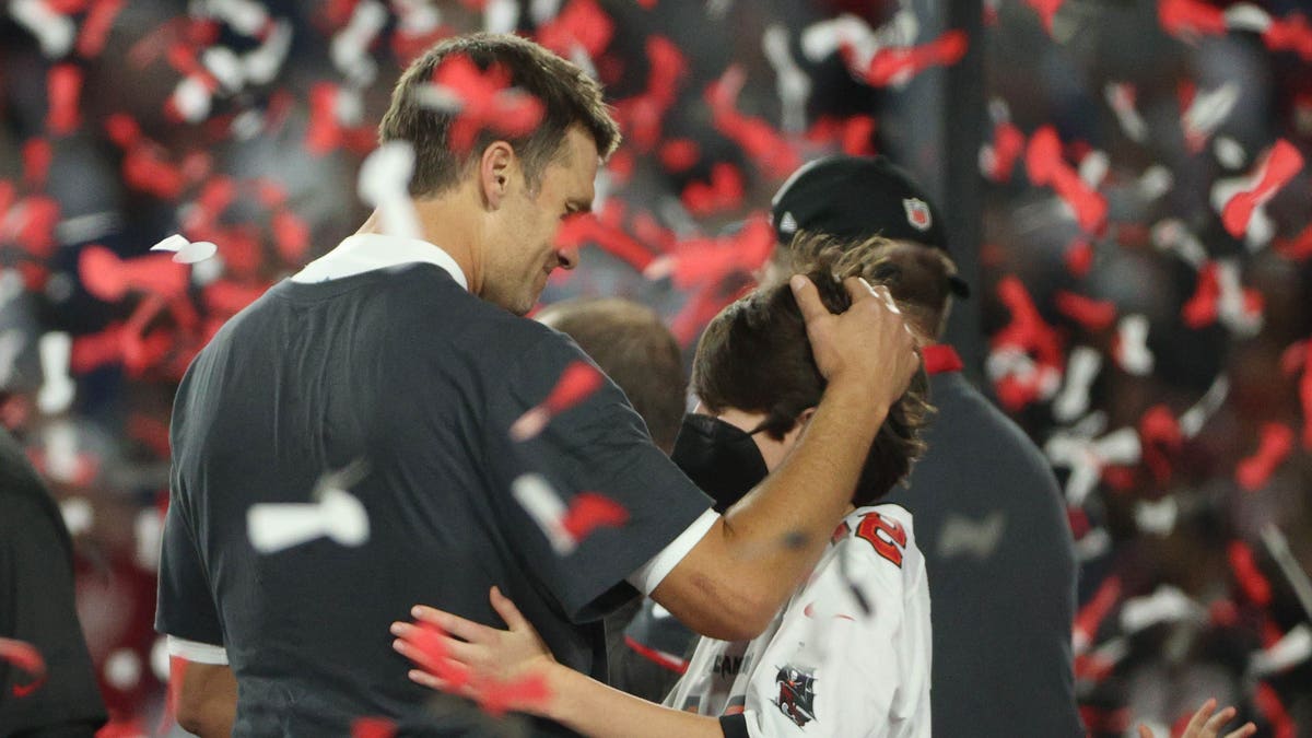 Tom Brady embraces son after winning Super Bowl