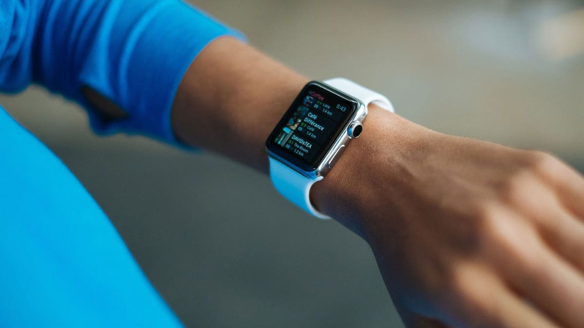 Photo of a woman wearing an Apple Watch on her wrist.