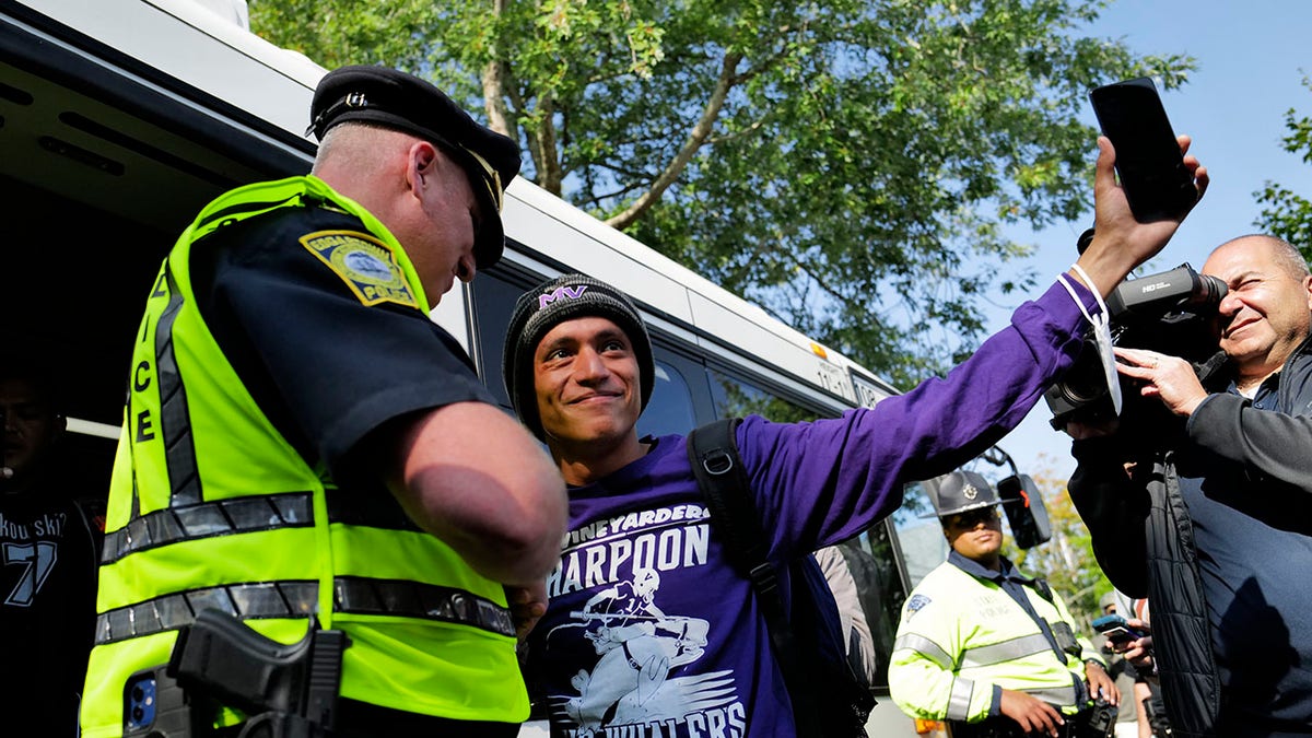 police officer by migrant on Martha's Vineyard