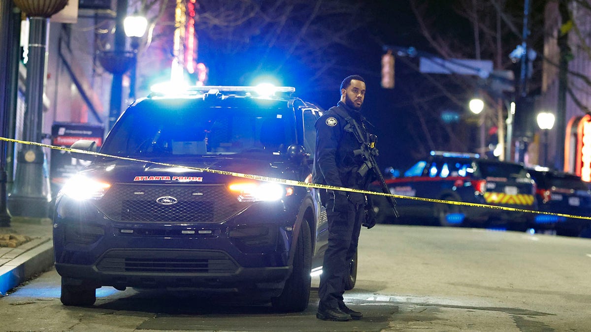 Atlanta police officer stands guard after unrest